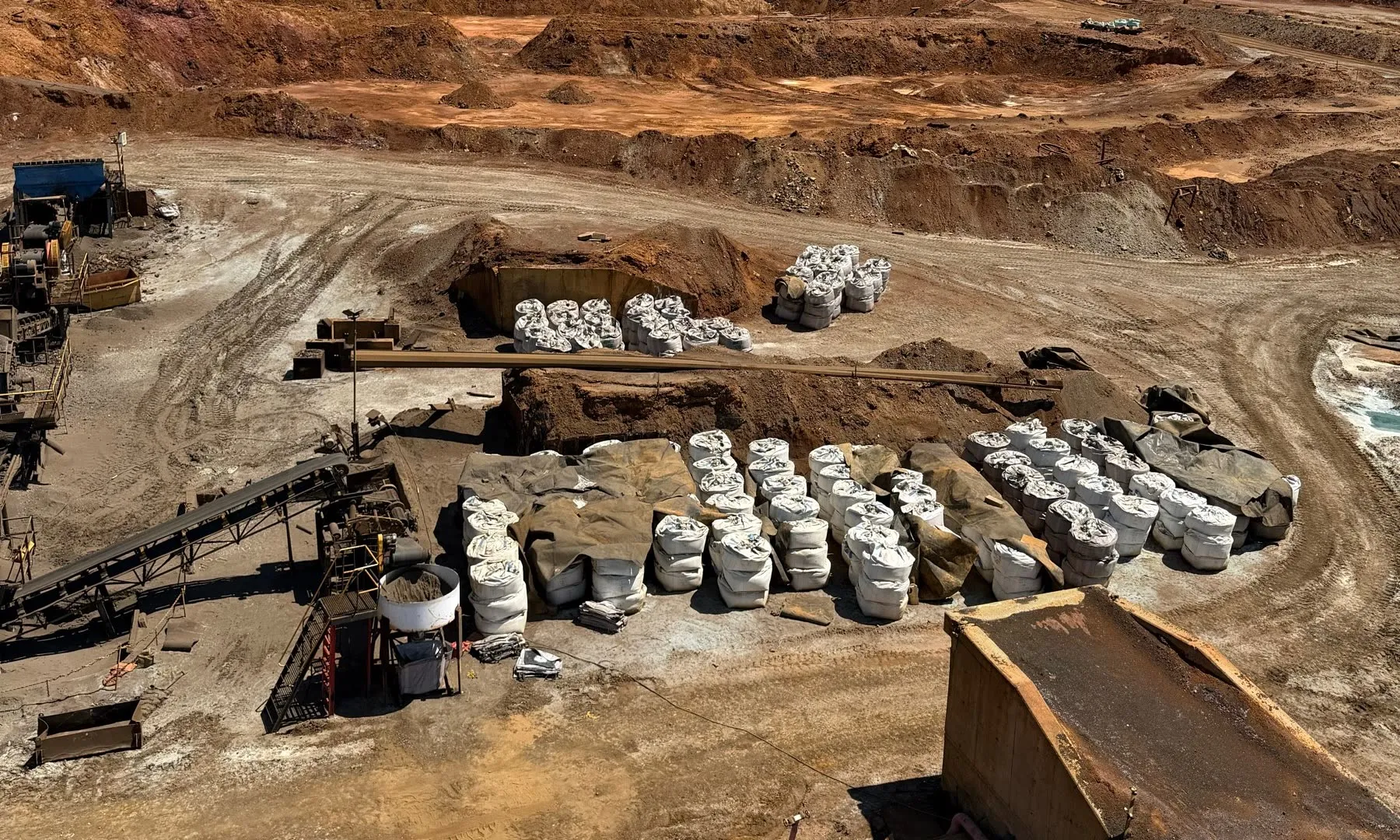 Rows of bagged material and stockpiles at the Selebi-Phikwe site